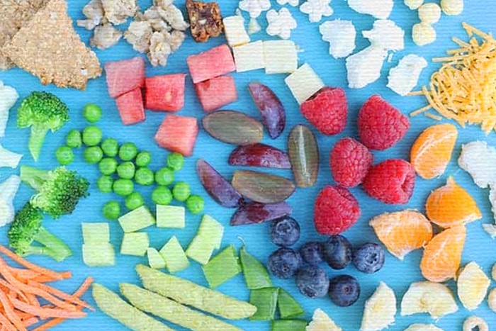 A table of fresh fruit and snacks